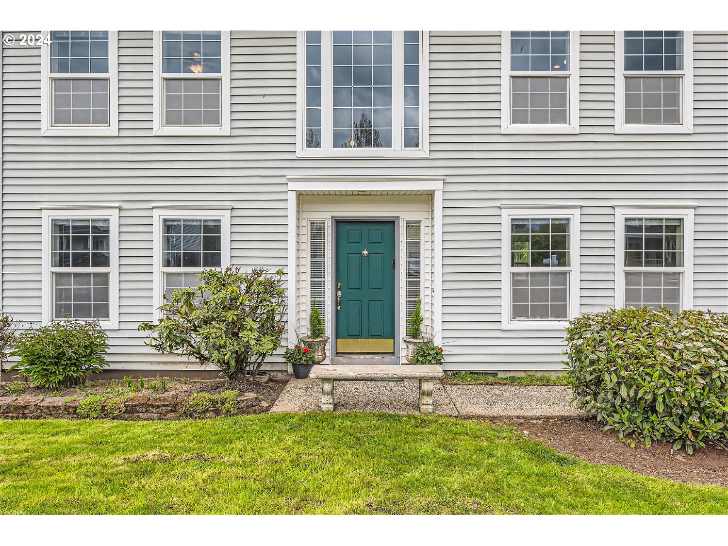 58916 Evergreen Loop St. Helens, OR 97051 - Photo 3 of 28 a front view of a house with a yard