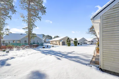 a view of a house with a snow in the yard