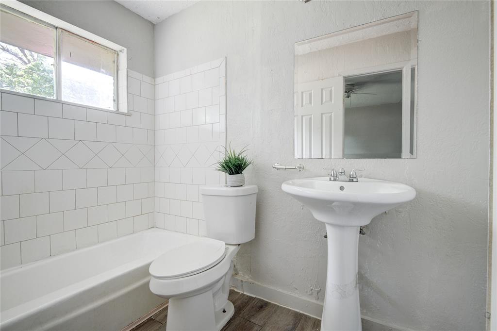 a bathroom with a sink toilet and bathtub