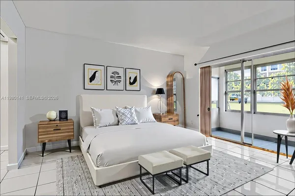 a spacious bedroom with a bed a table and a window