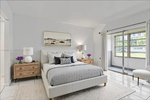 a bedroom with a bed a table and chair