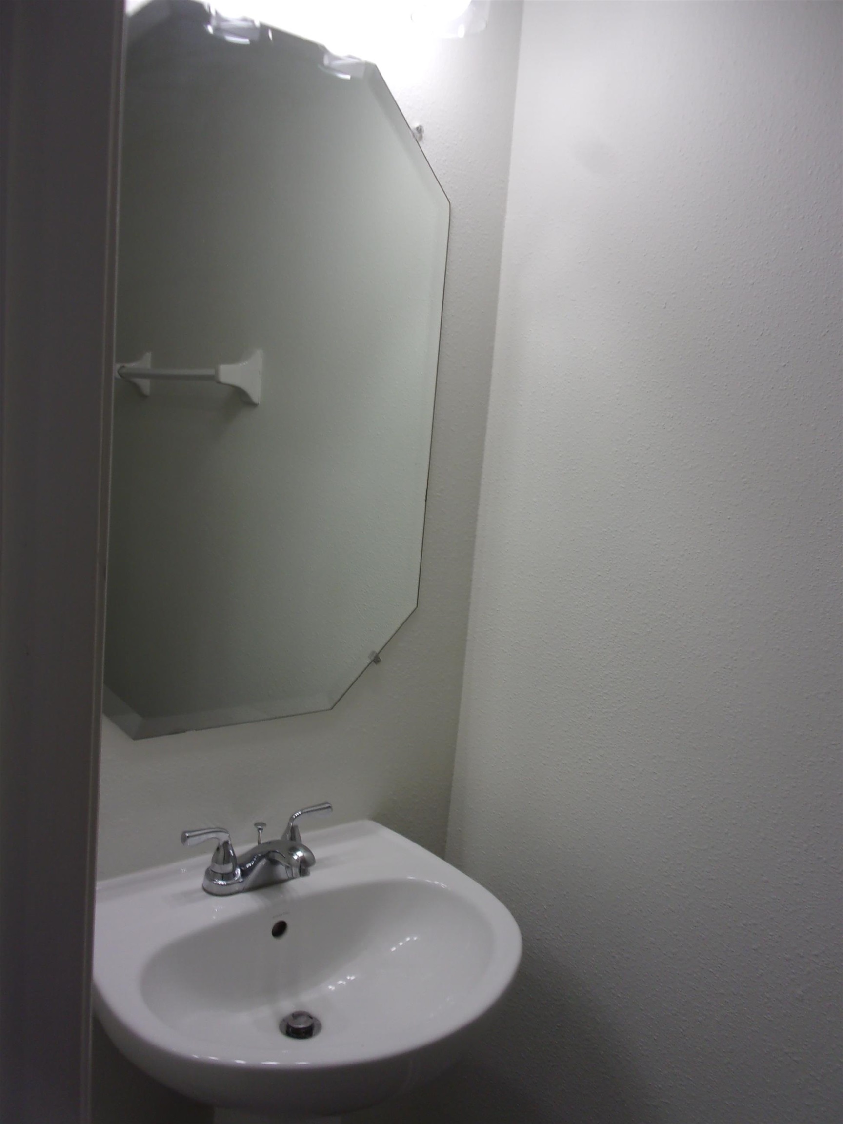 274 Syrah Way St. Augustine, FL 32084 - Photo 11 of 42 a bathroom with a sink and mirror