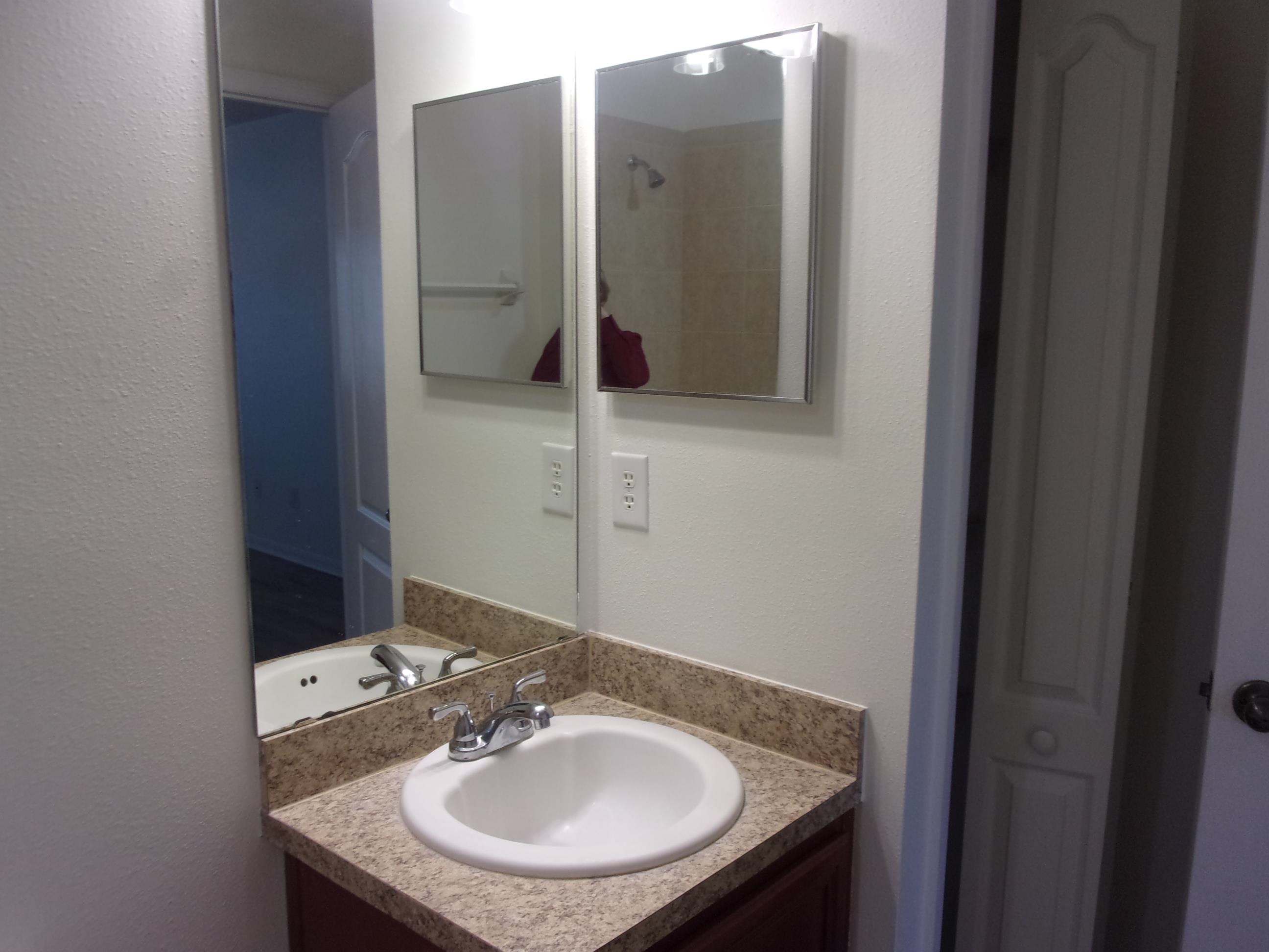 274 Syrah Way St. Augustine, FL 32084 - Photo 18 of 42 Bathroom featuring vanity and a textured wall