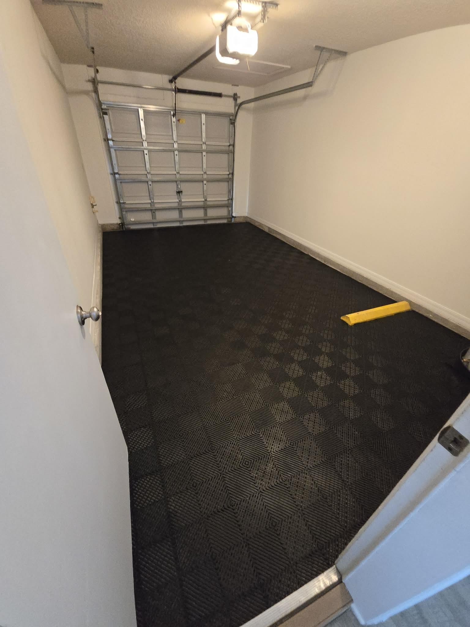 274 Syrah Way St. Augustine, FL 32084 - Photo 25 of 42 Garage with a garage door opener and baseboards