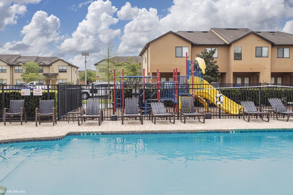 274 Syrah Way St. Augustine, FL 32084 - Photo 28 of 42 Community pool with a patio area and a residential view