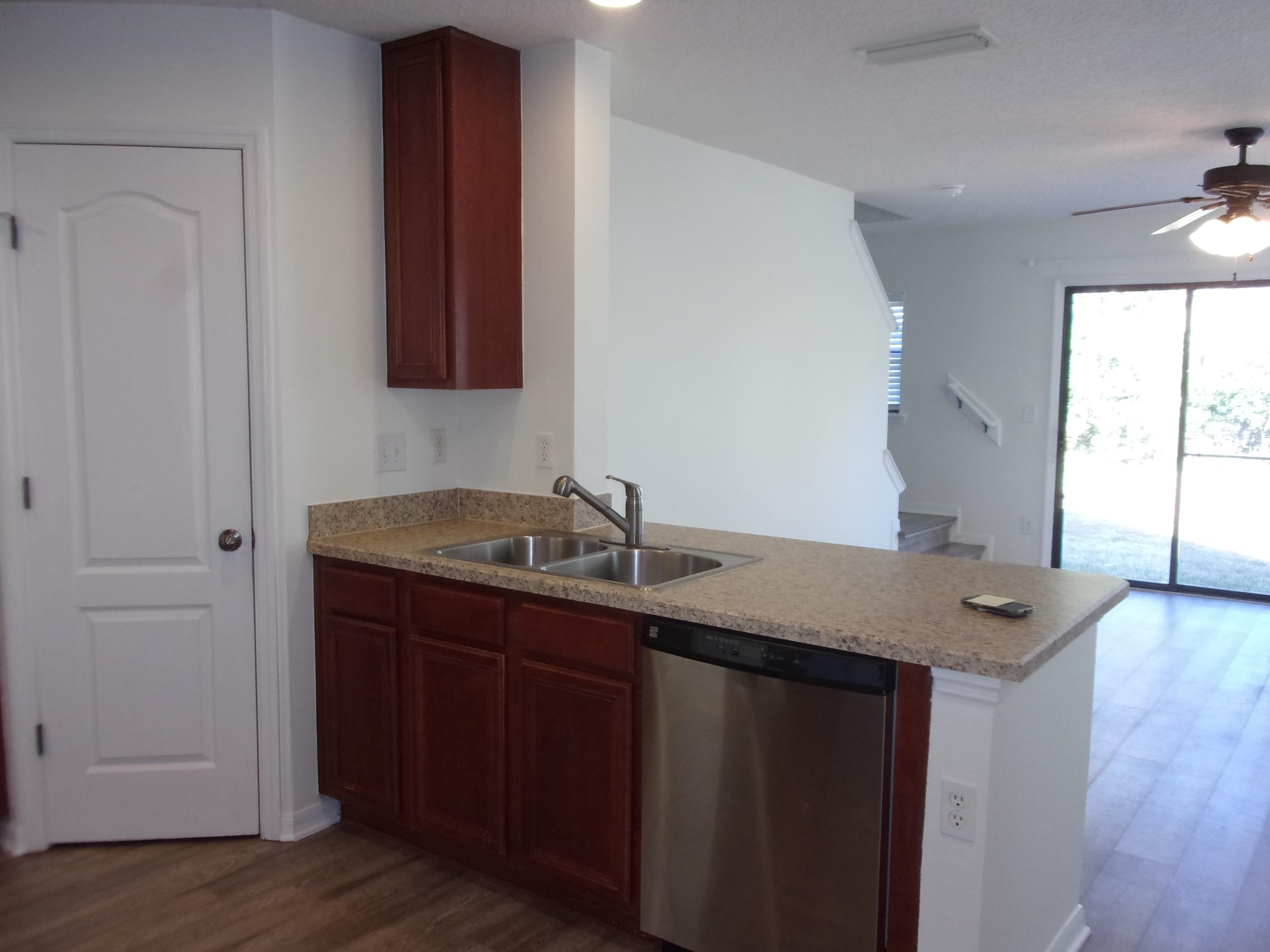 274 Syrah Way St. Augustine, FL 32084 - Photo 30 of 42 a bathroom with a granite countertop sink and a mirror
