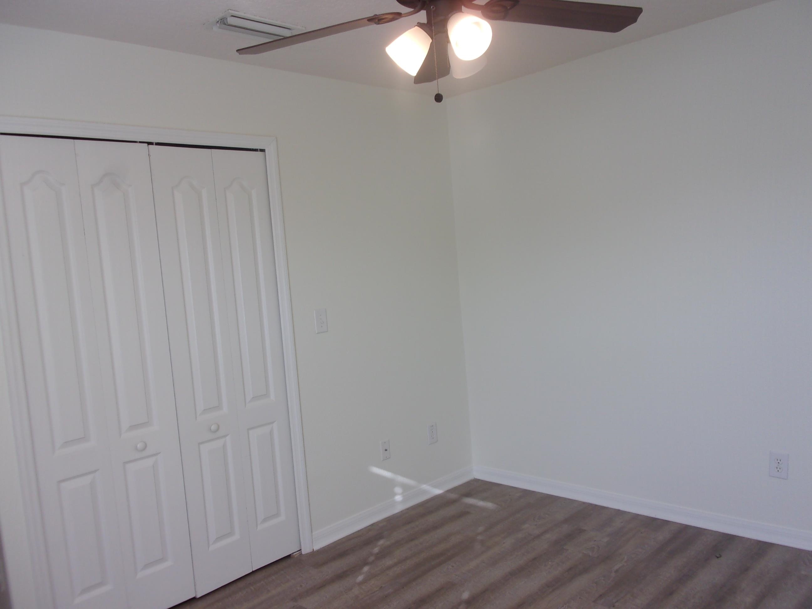 274 Syrah Way St. Augustine, FL 32084 - Photo 34 of 42 a view of an empty room with wooden floor