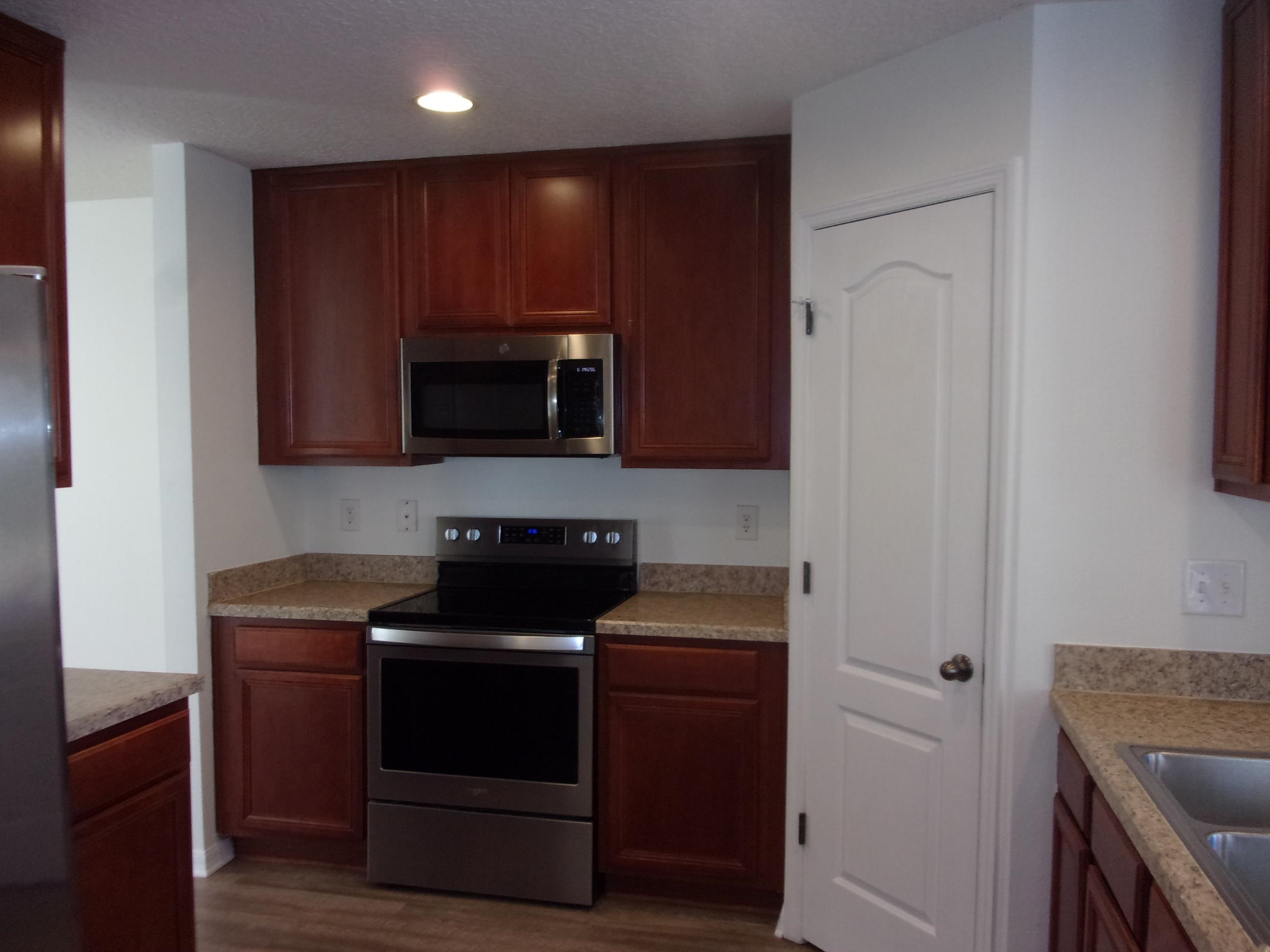 274 Syrah Way St. Augustine, FL 32084 - Photo 4 of 42 a kitchen with a stove and a microwave