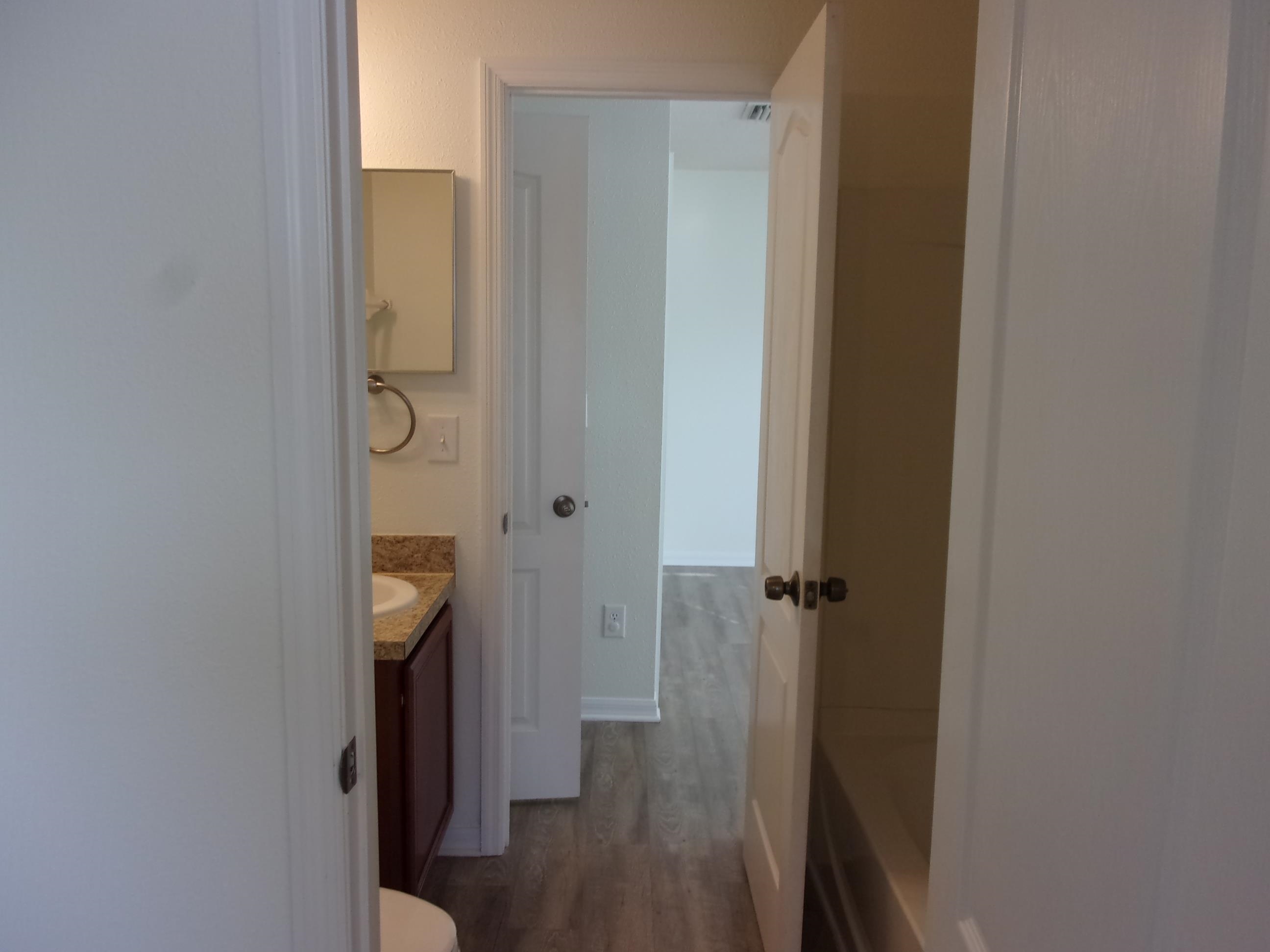 274 Syrah Way St. Augustine, FL 32084 - Photo 41 of 42 Full bathroom featuring vanity, wood finished floors, and a bathtub