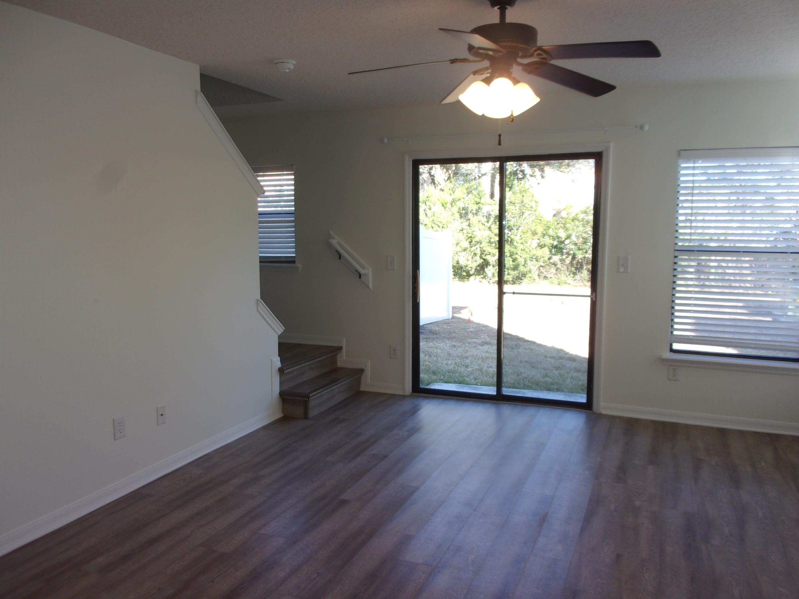 274 Syrah Way St. Augustine, FL 32084 - Photo 10 of 42 wooden floor in an empty room with a window