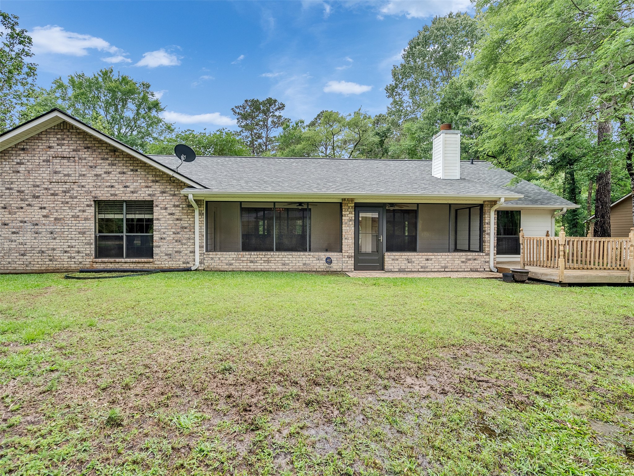 195 Coral Gables Trinity, TX 75862 - Photo 40 of 50 a front view of a house with a garden