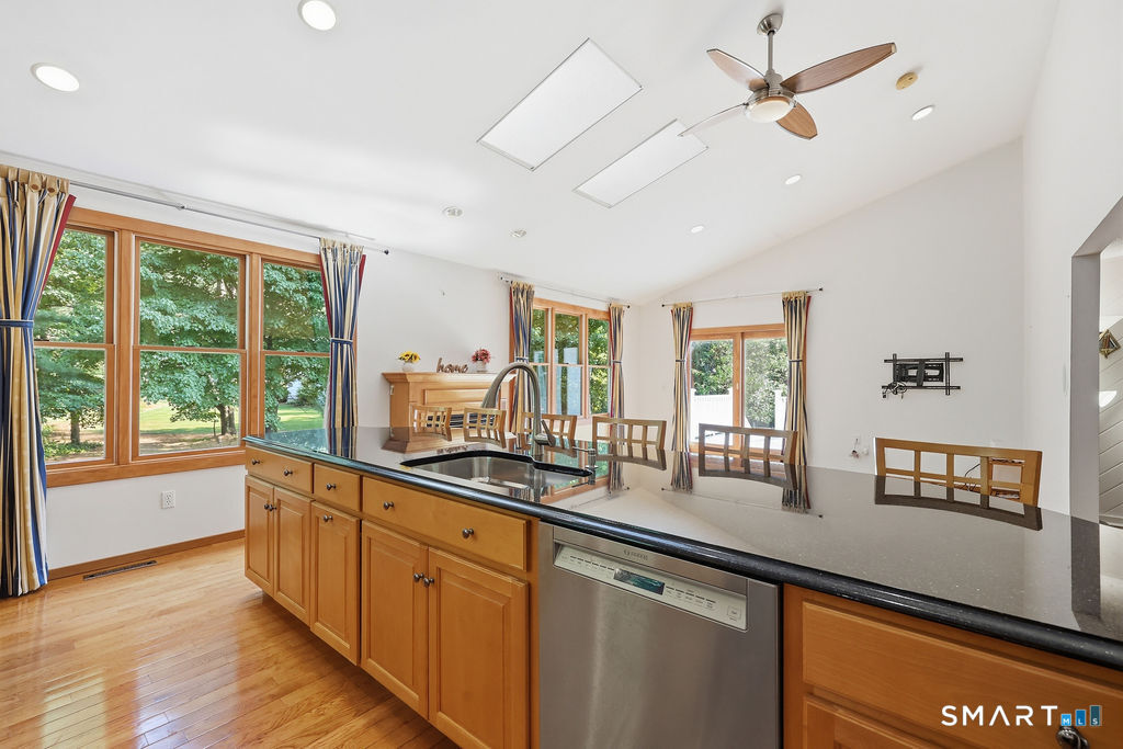 36 Banks Road Simsbury, CT 06092 - Photo 6 of 37 Granite countertops, high ceilings, stainless appliances and a view to the backyard.
