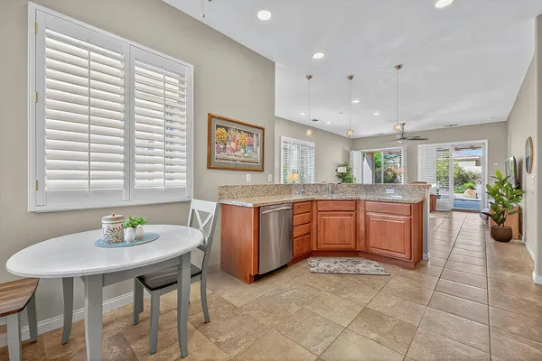 a kitchen with a table and chairs in it