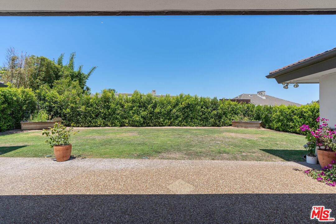 4245 Olympiad Drive View Park, CA 90043 - Photo 21 of 24 a backyard of a house with a yard and outdoor seating