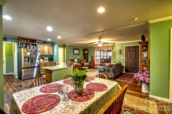 a view of a dining room with furniture and a window