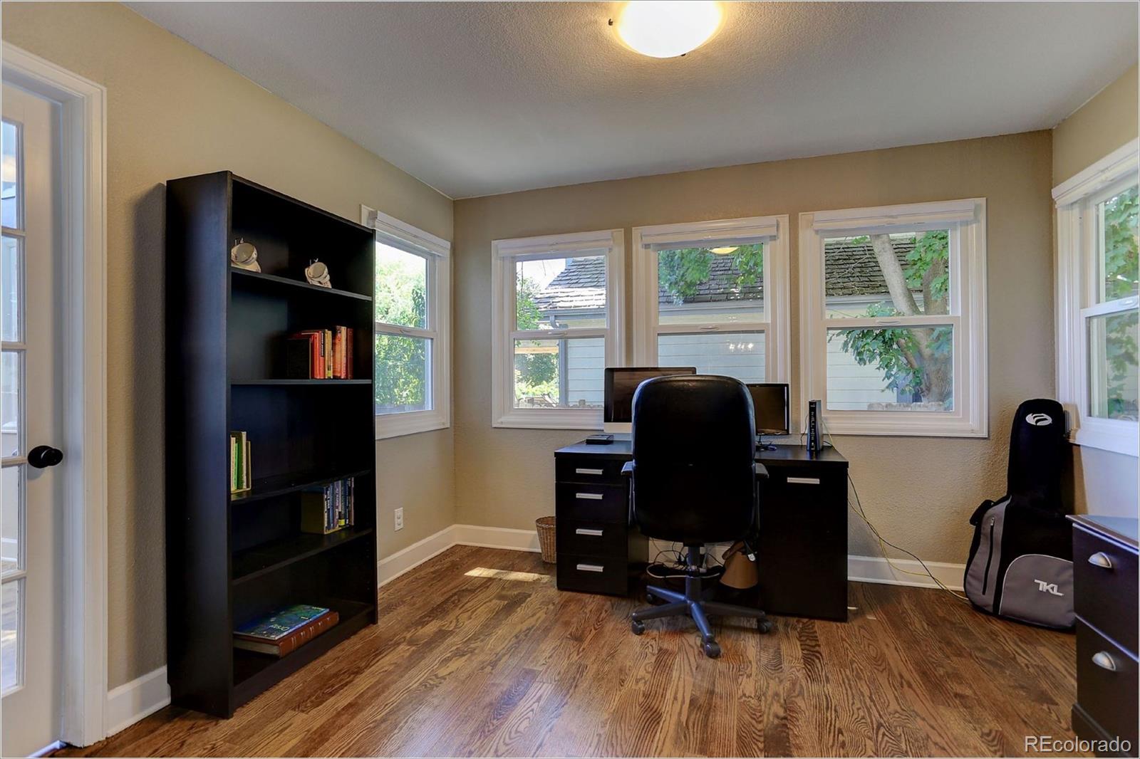 8401 Sweet Water Road Lone Tree, CO 80124 - Photo 21 of 35 a view of a workspace with furniture and a window