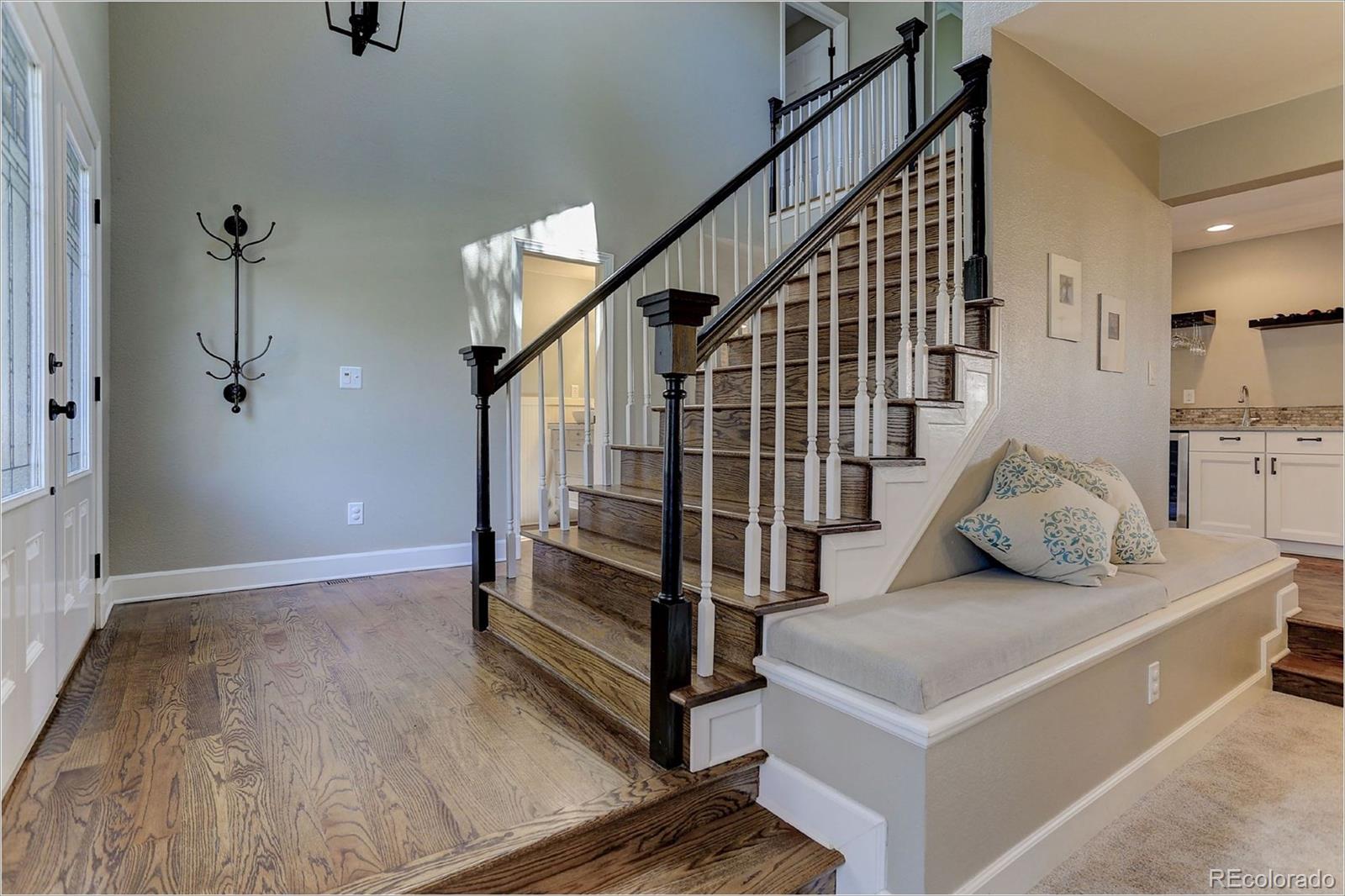8401 Sweet Water Road Lone Tree, CO 80124 - Photo 3 of 35 a view of entryway and hall with wooden floor
