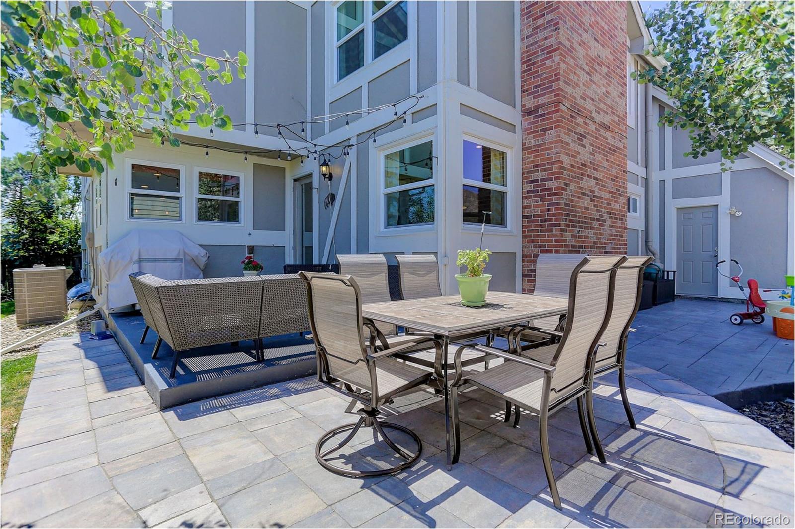 8401 Sweet Water Road Lone Tree, CO 80124 - Photo 34 of 35 a view of a patio with a table and chairs