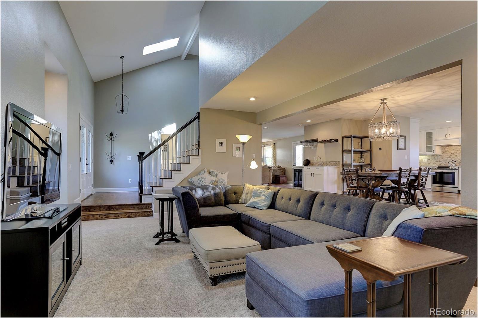 8401 Sweet Water Road Lone Tree, CO 80124 - Photo 5 of 35 a living room with furniture and a flat screen tv