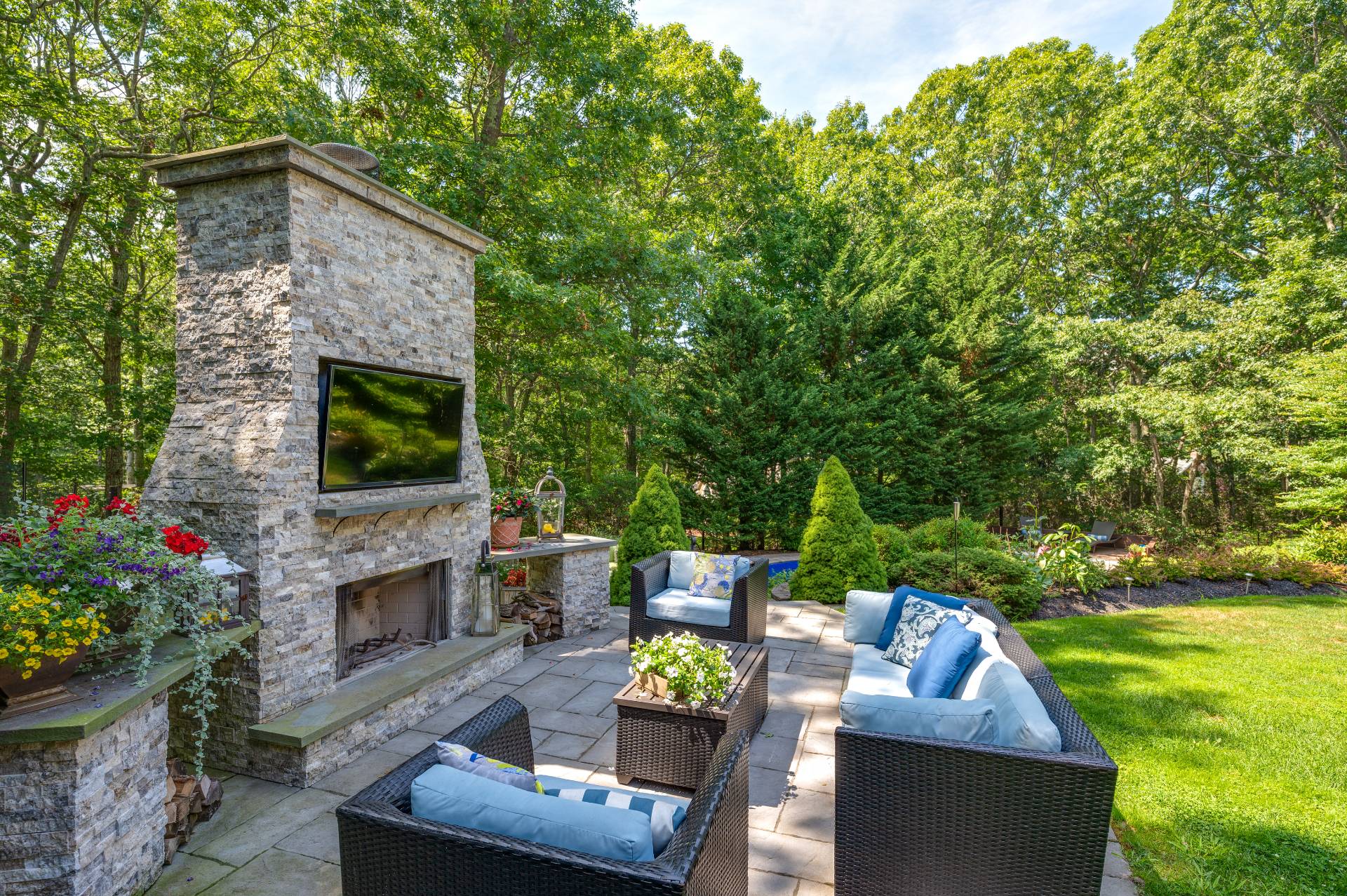 a front view of a house with patio chairs and a fire pit