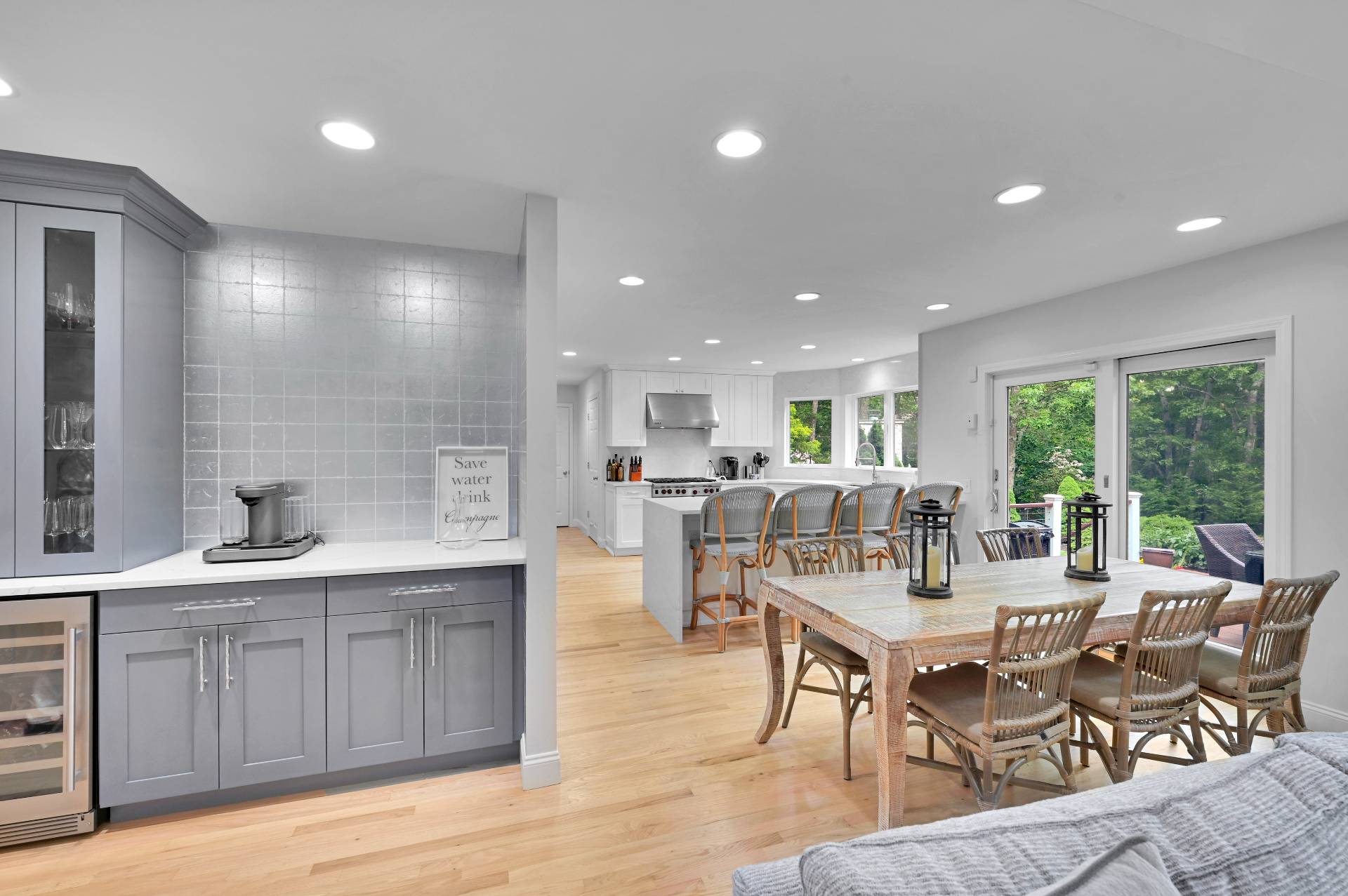 105 Northside Drive Sag Harbor, NY 11963 - Photo 11 of 33 a very nice looking dining room with kitchen island furniture a large window and a sink