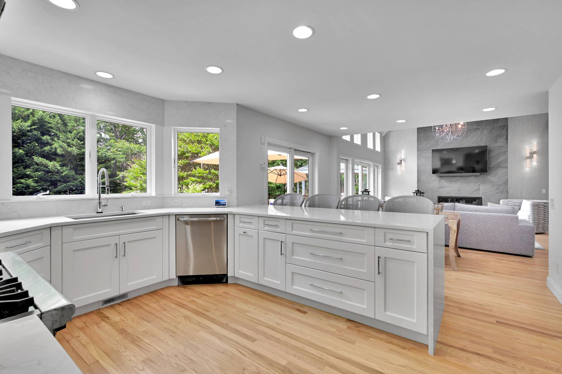 105 Northside Drive Sag Harbor, NY 11963 - Photo 14 of 33 a large kitchen with stainless steel appliances granite countertop a large center island and a sink