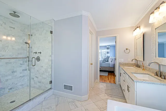 a spacious bathroom with a shower and a sink
