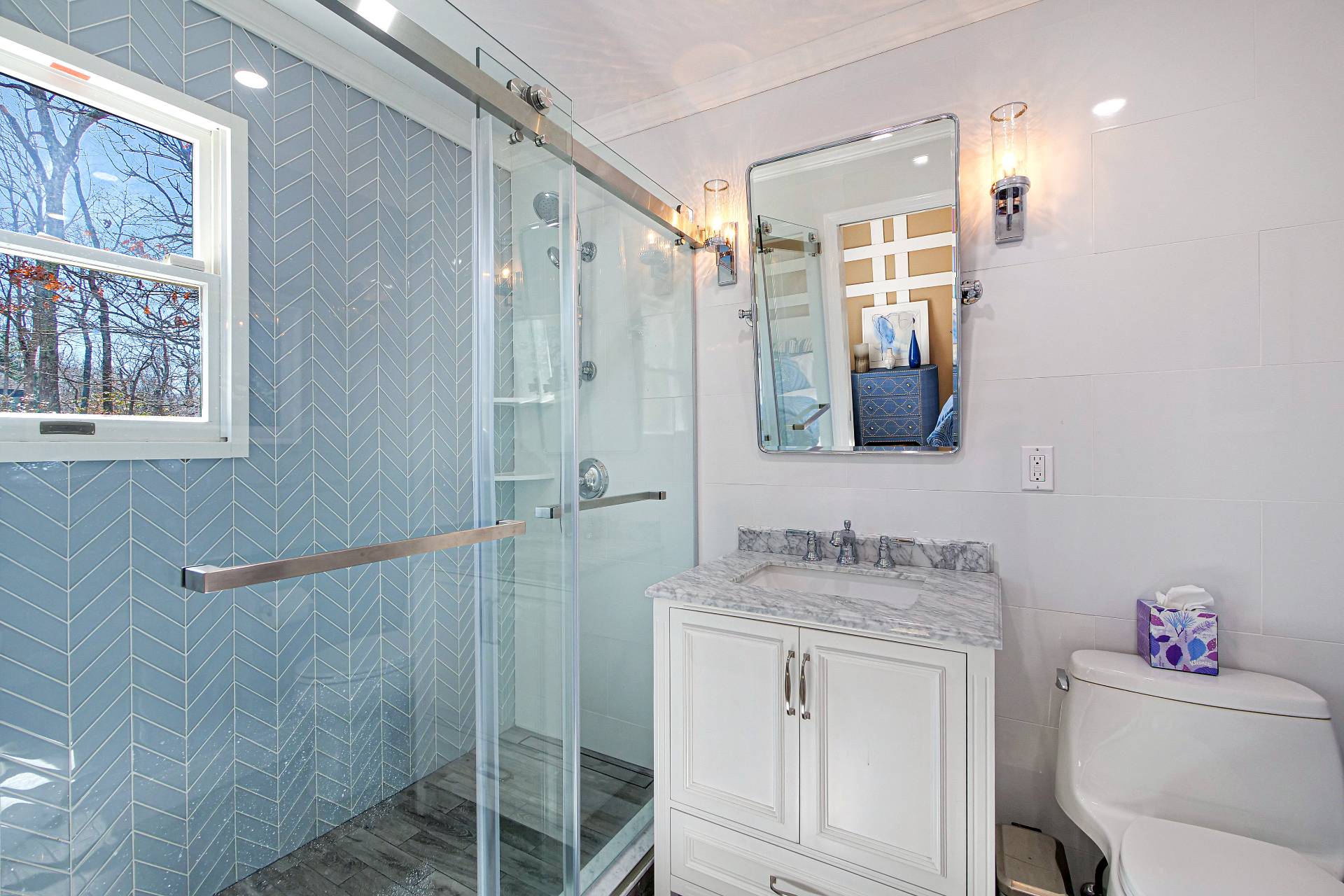 105 Northside Drive Sag Harbor, NY 11963 - Photo 24 of 33 a bathroom with a granite countertop sink mirror and a shower