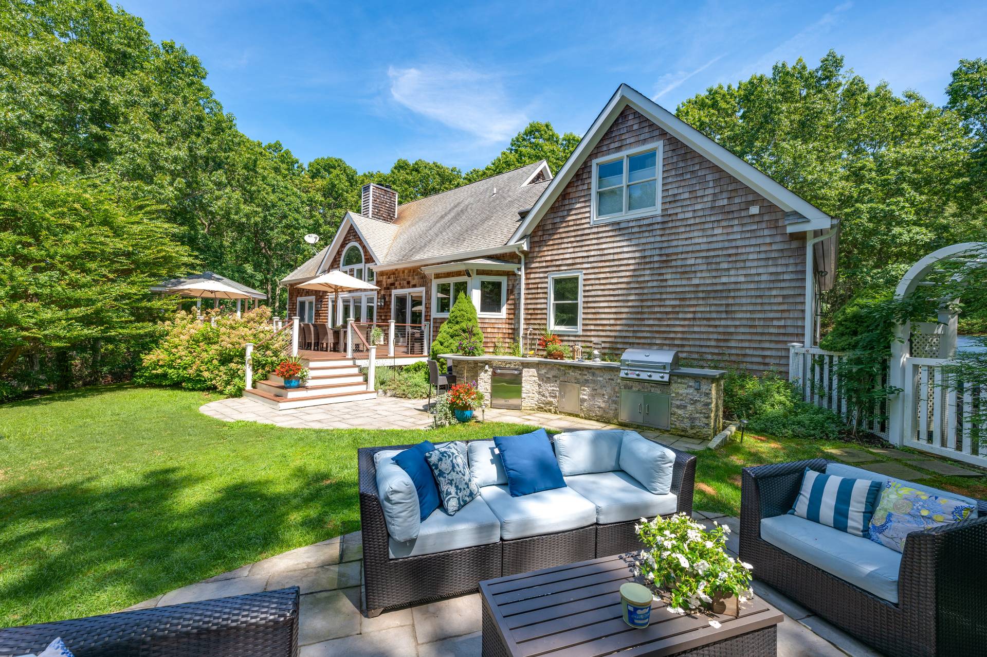105 Northside Drive Sag Harbor, NY 11963 - Photo 27 of 33 a view of a house with a couches in a patio