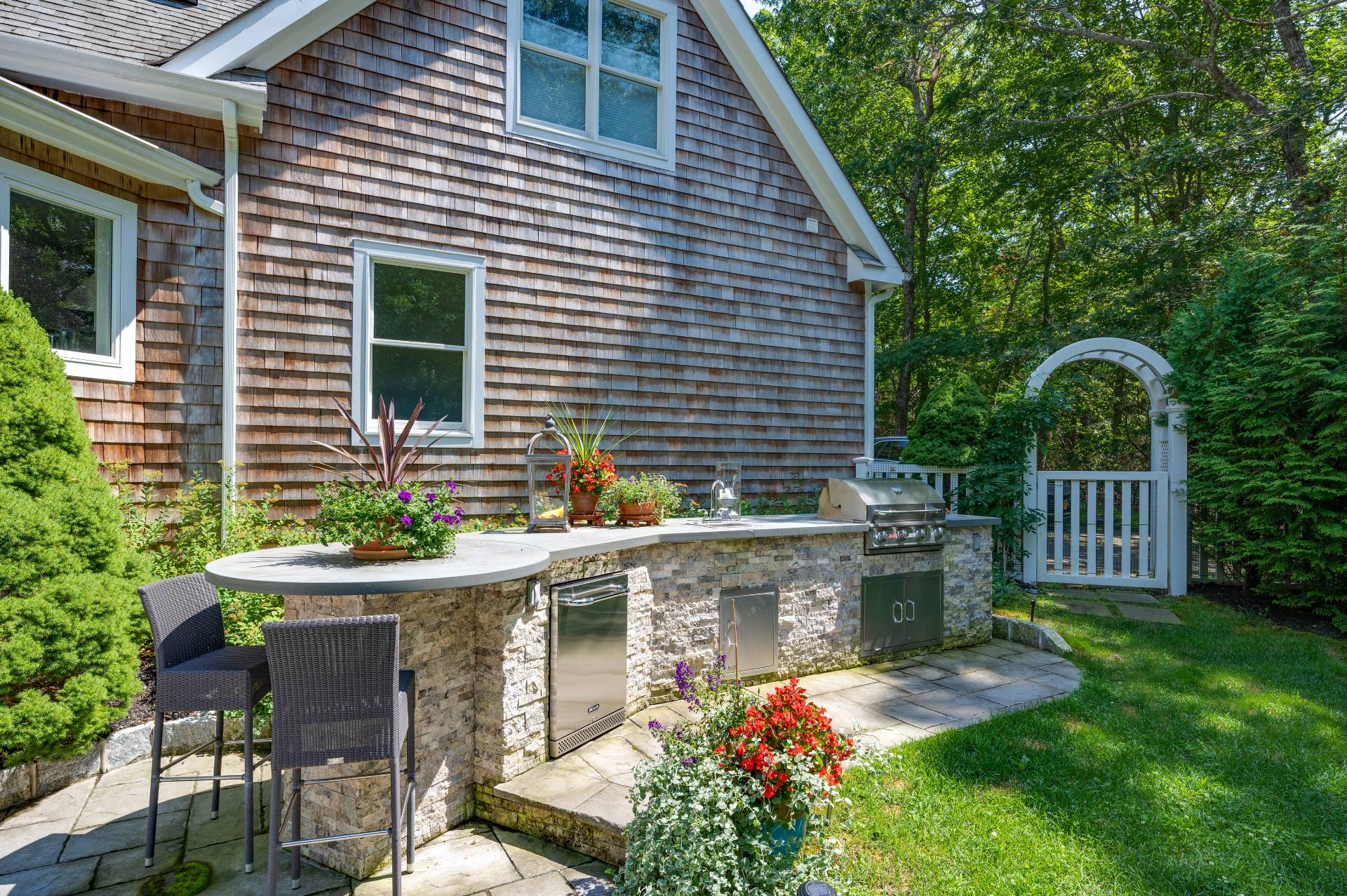 105 Northside Drive Sag Harbor, NY 11963 - Photo 28 of 33 a front view of a house with porch and garden