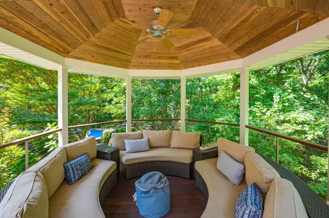 a balcony with furniture and a garden