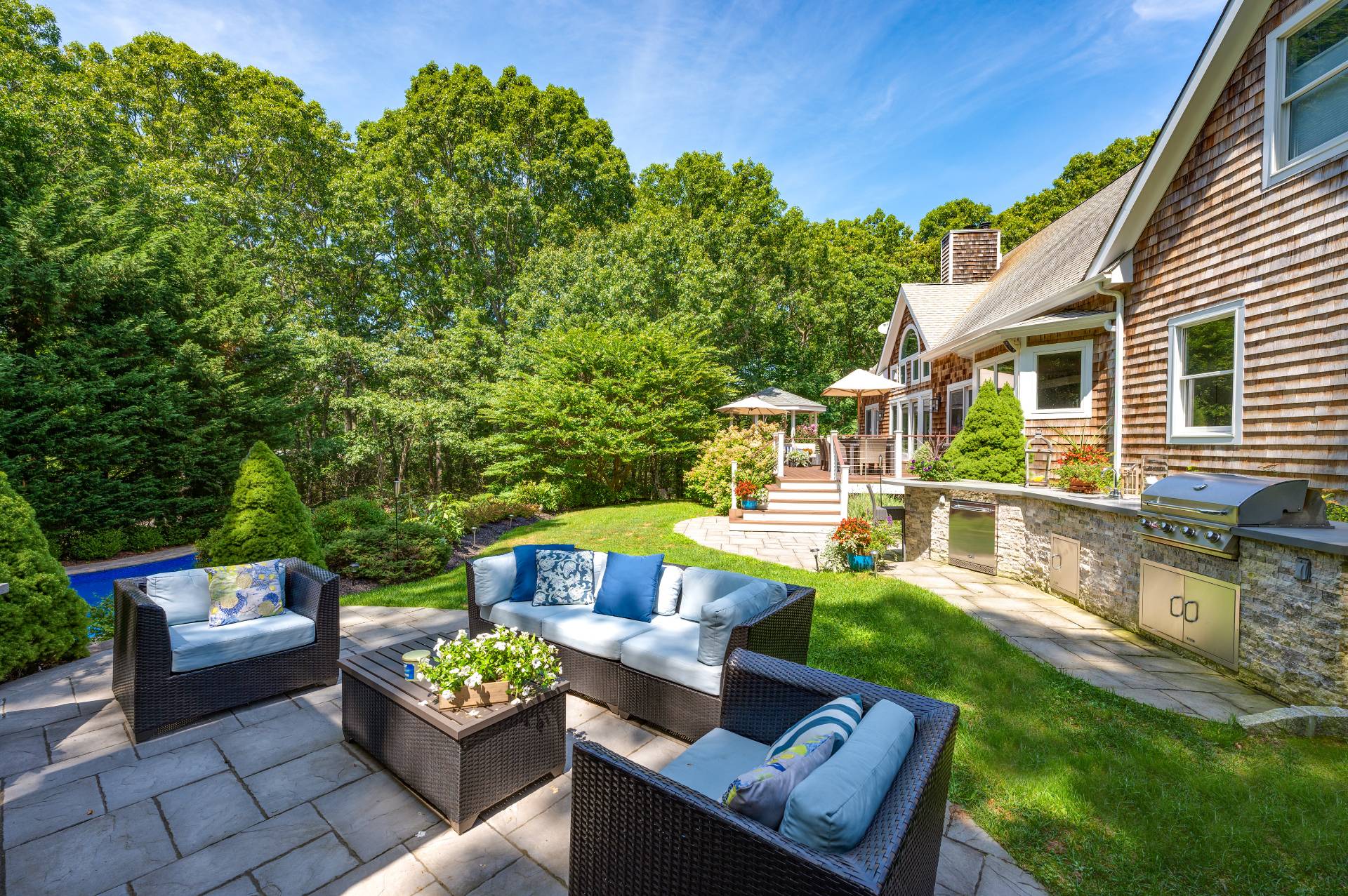 105 Northside Drive Sag Harbor, NY 11963 - Photo 30 of 33 a view of a patio with couches chairs and a fire pit