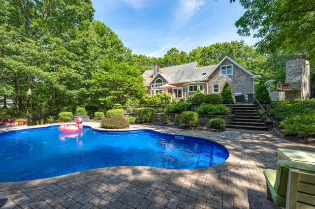 a view of a swimming pool with lounge chair