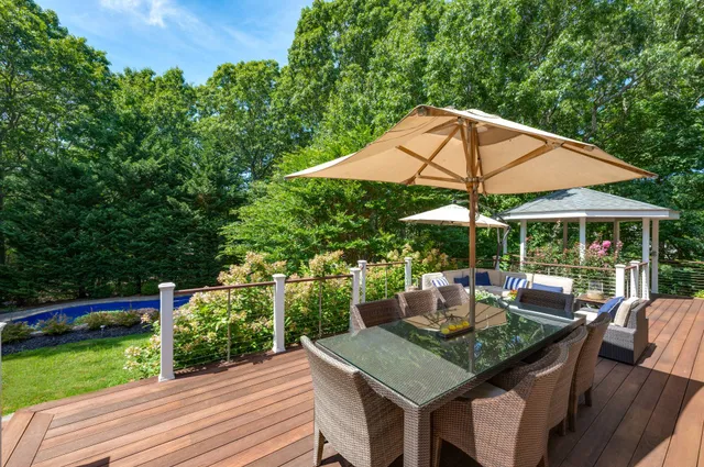 an outdoor space with furniture and umbrella