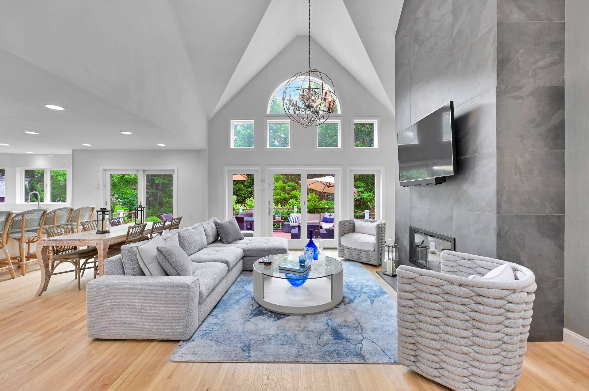 105 Northside Drive Sag Harbor, NY 11963 - Photo 9 of 33 a living room with furniture a large window and a fireplace