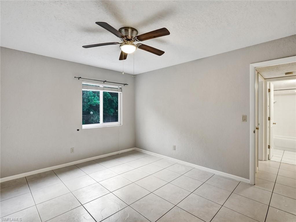 4621 Bayshore Drive, Unit Q1 Naples, FL 34112 - Photo 18 of 25 a view of an empty room with a window