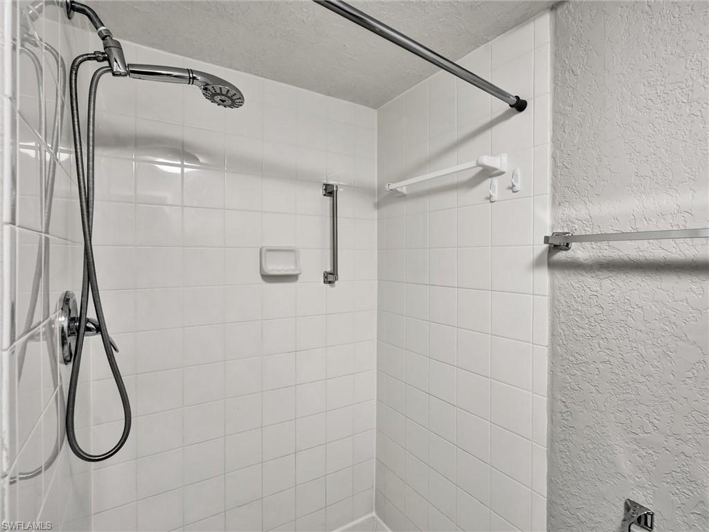 4621 Bayshore Drive, Unit Q1 Naples, FL 34112 - Photo 20 of 25 a bathroom with a shower