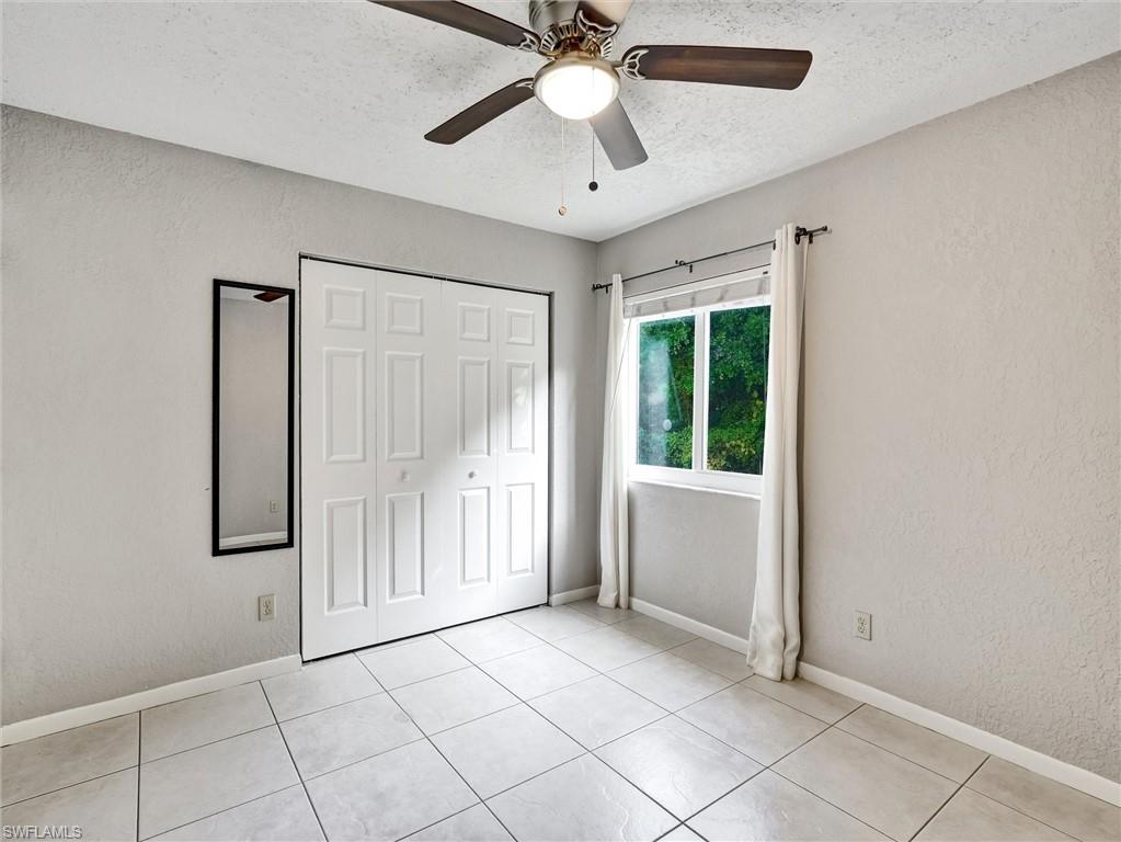 4621 Bayshore Drive, Unit Q1 Naples, FL 34112 - Photo 22 of 25 a view of an empty room with a window