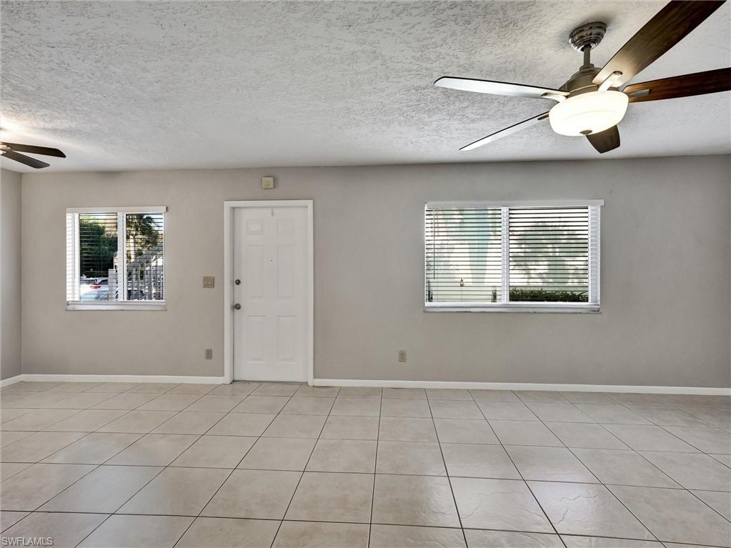 4621 Bayshore Drive, Unit Q1 Naples, FL 34112 - Photo 9 of 25 a view of an empty room with a window