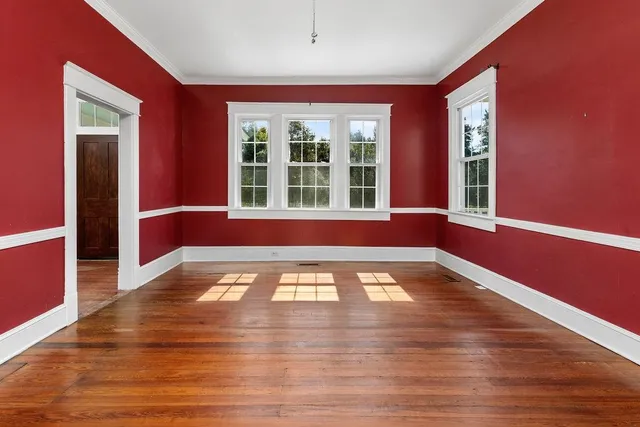 a view of a balcony with wooden floor