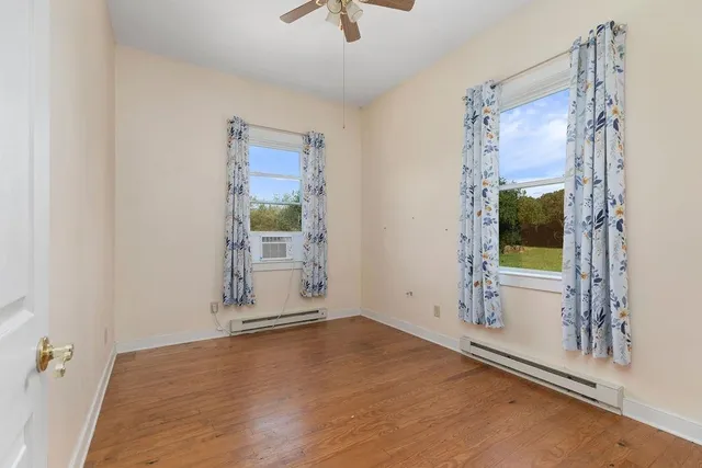 a view of a field with an ocean