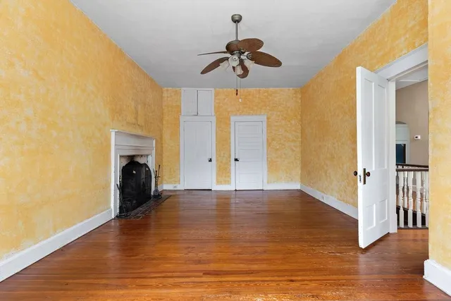 an aerial view of a house with a yard