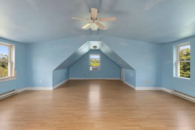 a view of a lake with a house in the background