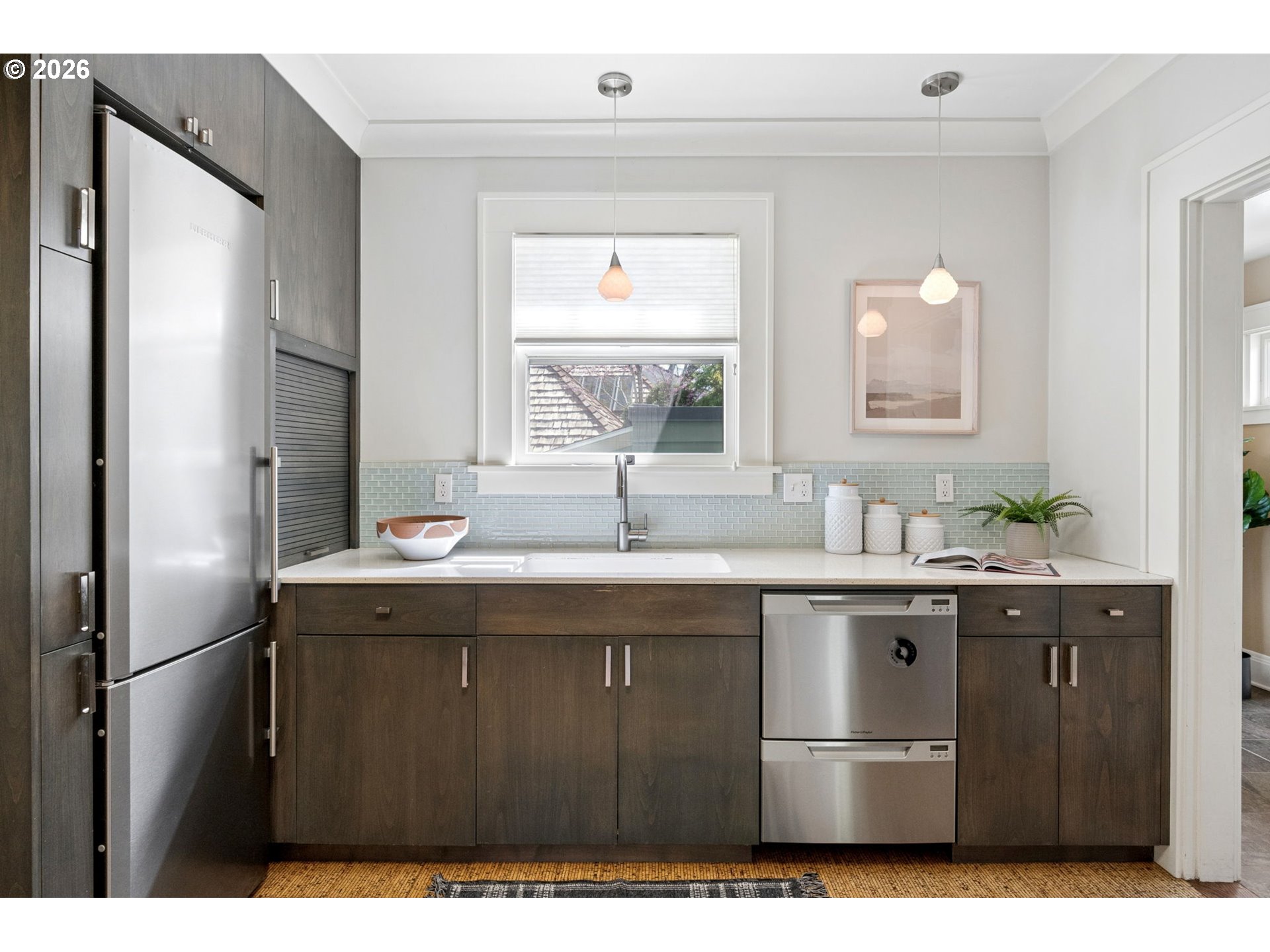 3434 Northeast Peerless Place Portland, OR 97232 - Photo 15 of 40 a kitchen with a sink a refrigerator and window