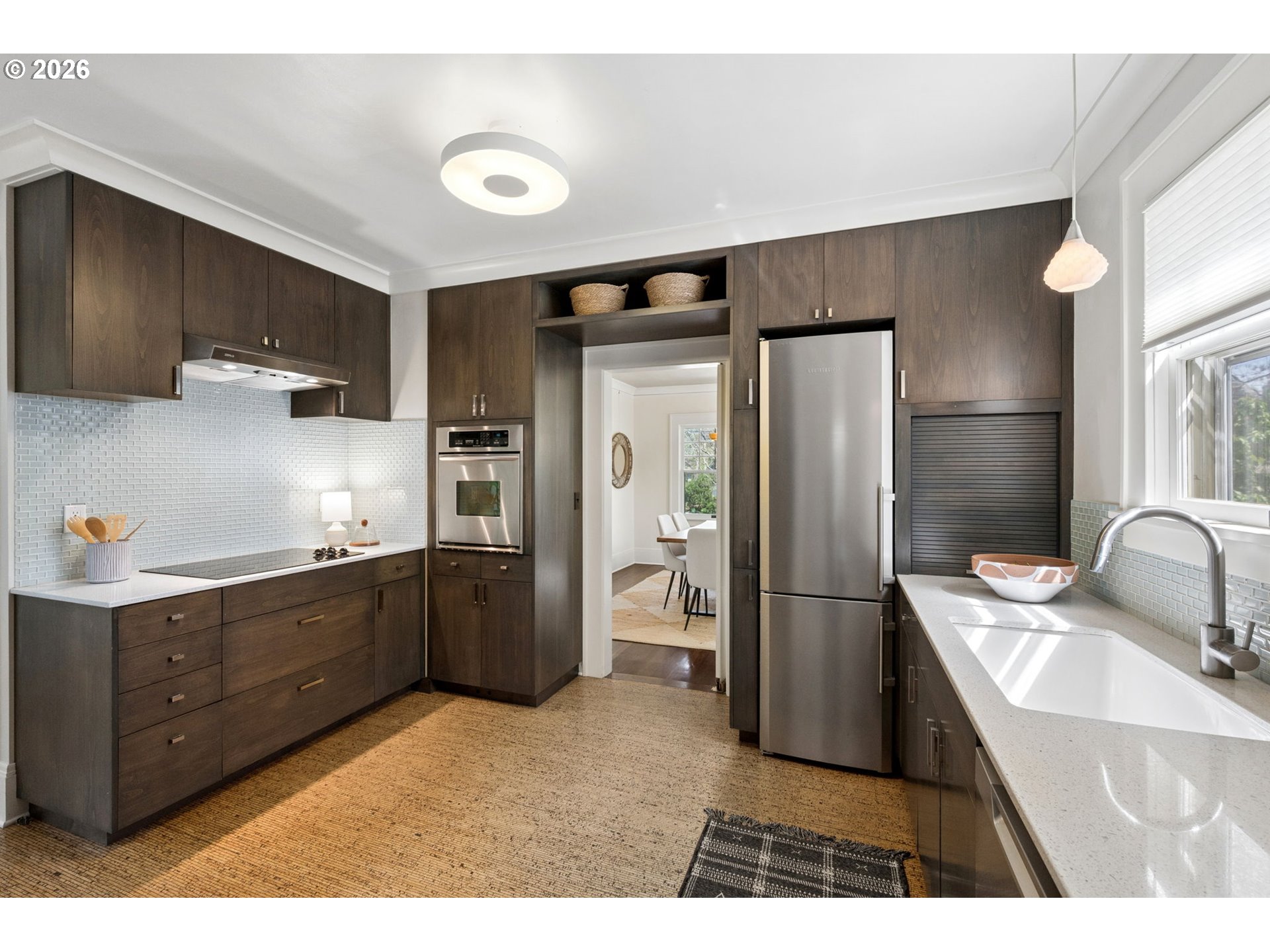 3434 Northeast Peerless Place Portland, OR 97232 - Photo 16 of 40 a kitchen with stainless steel appliances granite countertop a refrigerator and a sink