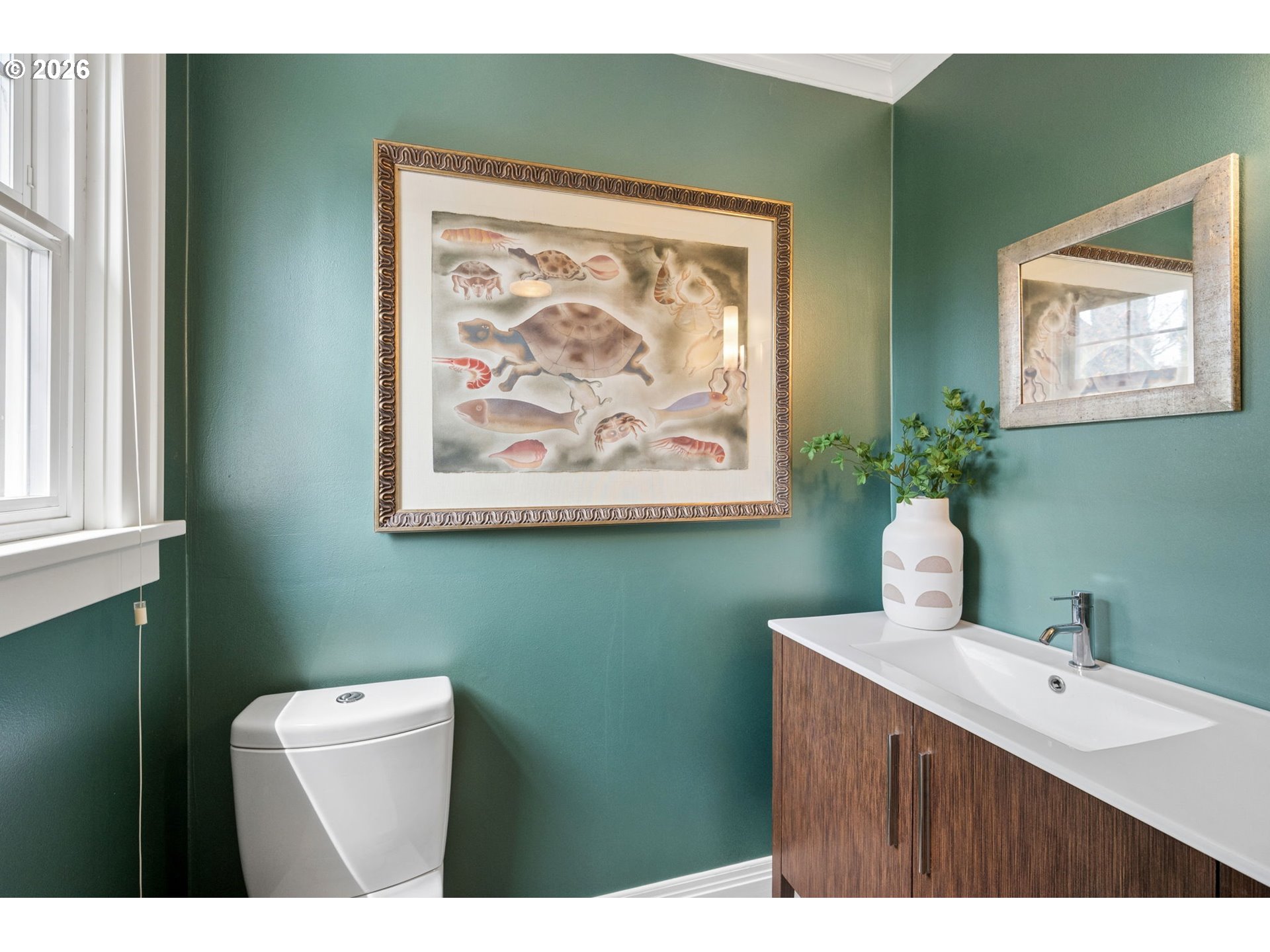3434 Northeast Peerless Place Portland, OR 97232 - Photo 21 of 40 a bathroom with a toilet sink and mirror