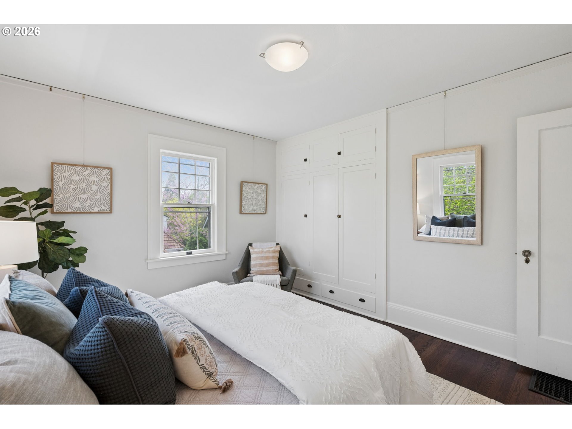 3434 Northeast Peerless Place Portland, OR 97232 - Photo 27 of 40 a bedroom with a bed and a window