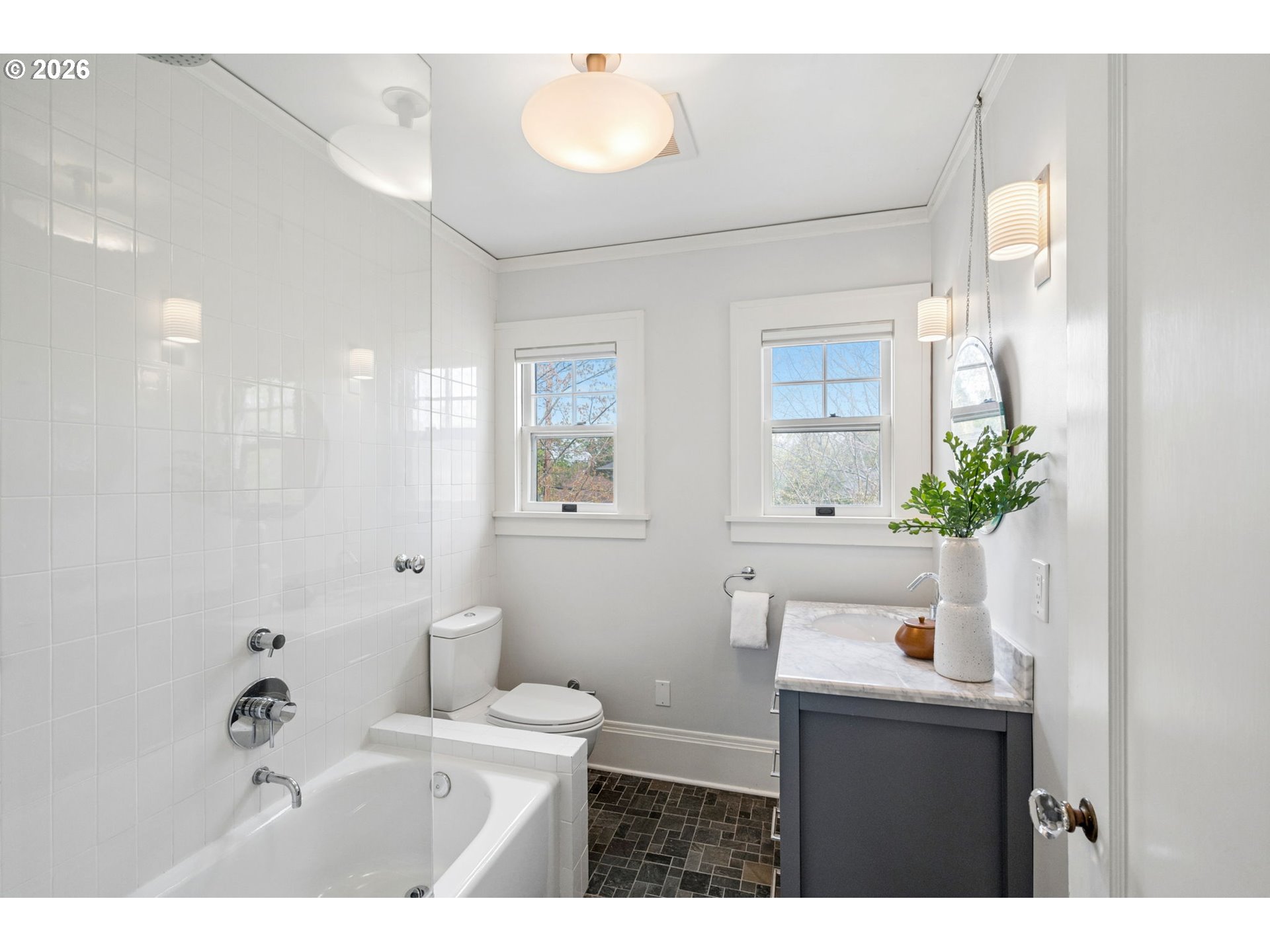 3434 Northeast Peerless Place Portland, OR 97232 - Photo 28 of 40 a bathroom with a sink a mirror and a toilet