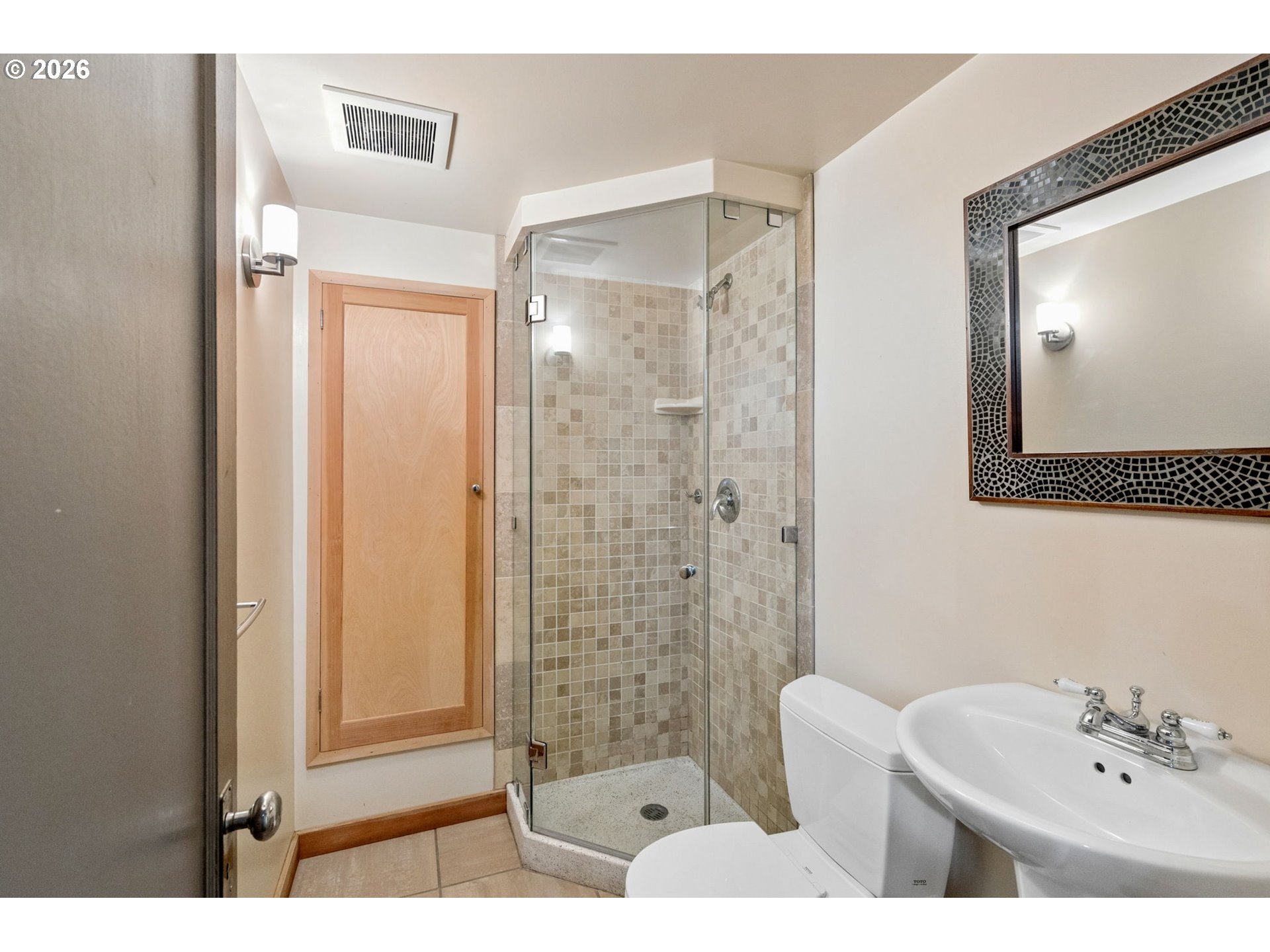 3434 Northeast Peerless Place Portland, OR 97232 - Photo 32 of 40 a bathroom with a sink a toilet and shower