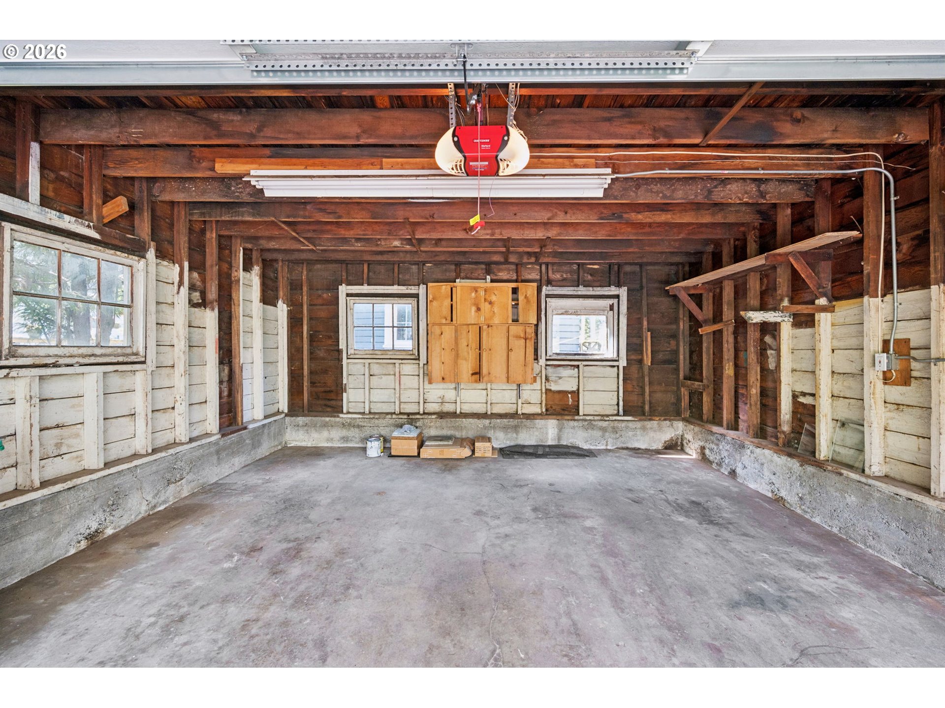 3434 Northeast Peerless Place Portland, OR 97232 - Photo 37 of 40 a view of a room with wooden walls and stairs